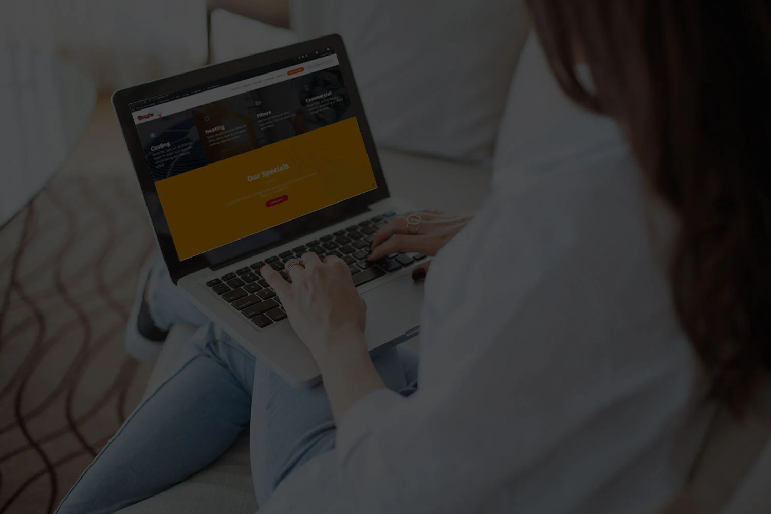 woman on a tablet looking at guys ac website